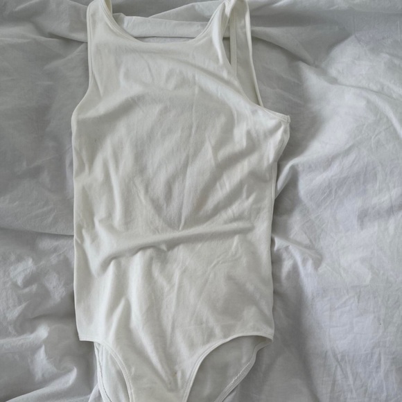 Aritzia Tops - aritzia community white backless bodysuit in size S